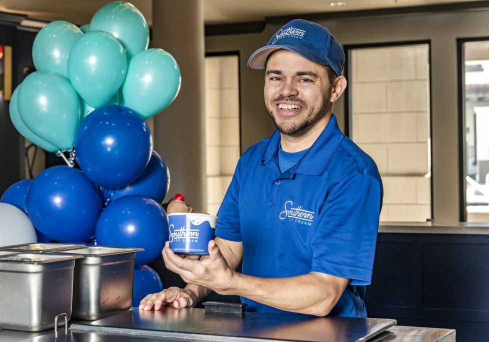 happy ice cream professional with a sundae